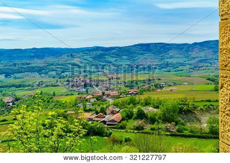 Landscape Of Vineyards And Countryside In Beaujolais, With The Village Saint-laurent-d-oingt. Rhone 