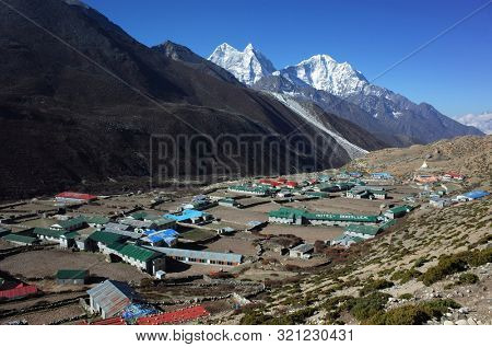 Sagarmatha national park, Dingboche, Nepal - May 20, 2019: View of Dingboche village (4410 m) from the trail of Everest trek