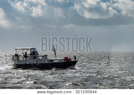 Ameland, The Netherlands, 09/03/2019, Motor Boat Departs From The Port Of Nes In Ameland And Goes To