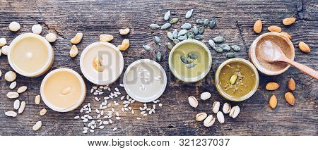 Nuts And Seeds Butter With Ingredients. Homemade Raw Organic Peanut, Almond, Hazlenut, Cashew, Pista