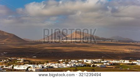 Typical Canarian Village Or Town With White Houses And Volcanic Landscape, Nazaret, Lanzarote Island