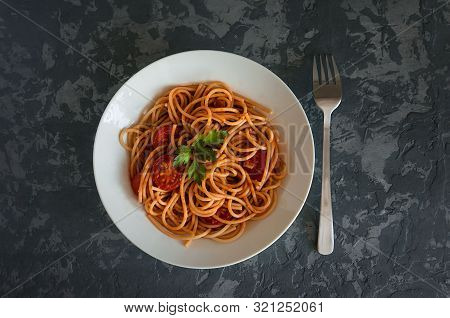 Spaghetti With Tomato Sauce And Pieces Of Chicken Or Turkey. Italian Food. Top View
