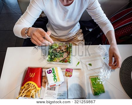 Chatte, France - Aug 11, 2017: View From Above Of Curious Impatient Woman Preparing To Eat Multiple 