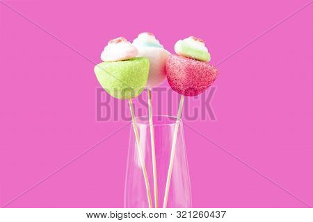 Candy Marshmallows In The Form Of Flowers In A Glass Goblet On A Pink Background.. Candy Bar.
