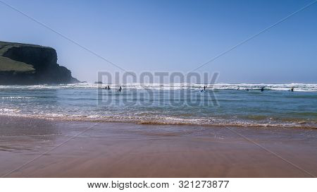 Beachgoers On Mawgan Porth Beach, North Cornwall, England, Uk