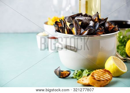 Belgian mussels in white wine with lemon, herbs, croutons and french fries
