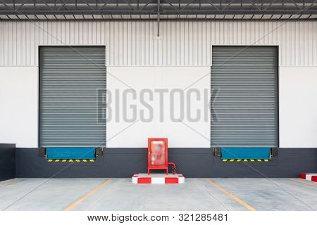 Shutter Door Or Roller Door And Concrete Floor Outside Factory For Loading And Unloading Goods In In
