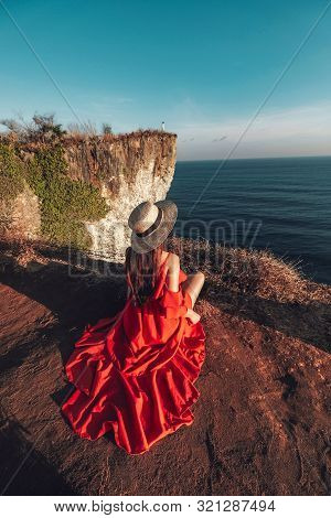 Couple Adventure And Looking View On The Karang Boma Cliff At Uluwatu Bali In Indonesia