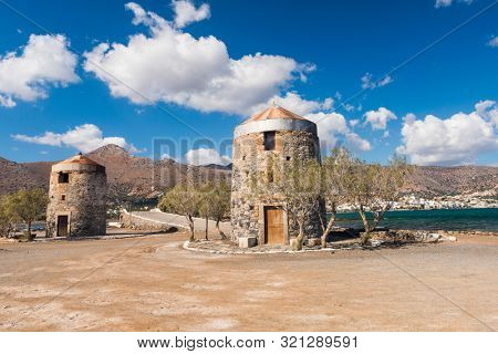 Old Windmills Poros Elounda at Spinalonga Peninsula near the town of Elounda, Island of Crete - Greece