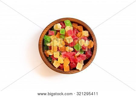 Candied Dried Pineapple Yellow, Orange,  Red And Green  In A Wooden Cedar Plate On A White Isolated 