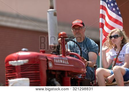 Buckhannon, West Virginia, Usa - May 18, 2019: Strawberry Festival, Old Tractors Being Driven Along 