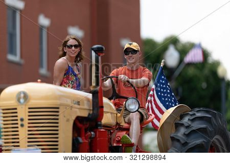 Buckhannon, West Virginia, Usa - May 18, 2019: Strawberry Festival, Old Tractors Being Driven Along 