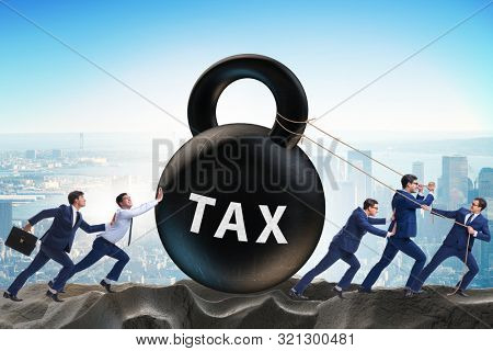 Businessman pulling kettlebell in tax concept