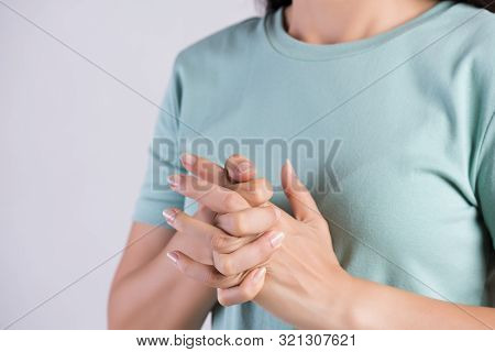 Healthcare And Medical Concept. Close Up Woman Cracking Knuckles.