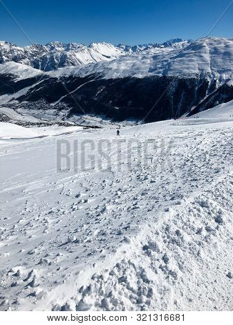 Only One Snowboarder On Slope In Mountains In Italy Livigno. Ski Resort. Alps.