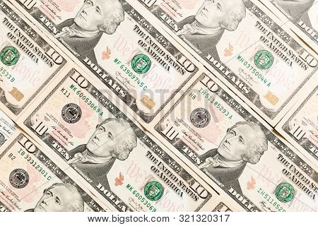 Close Up Of 10 Dollar Bills As A Background. Amarican Dollars Pattern. Top View Of Business Concept