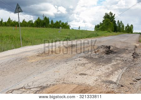Broken Road Bump On The Track Emergency Situation, Unrepaired Rural Road