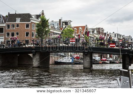Amsterdam, Holland - July 1, 2017: Amsterdam Is One Of The Most Well Known Bicycle Friendly Cities W