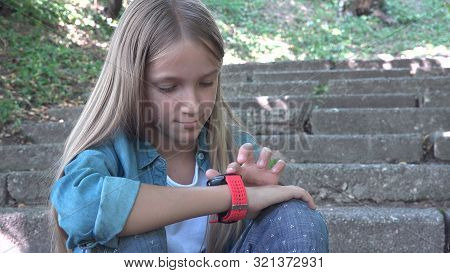 Smart Watch, Child Using Smartwatch Outdoor In Park, Kid Playing At Smartphone
