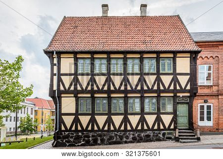 An Ancient Yellow Half-timbered House In The Old Quarters Of Svendborg, Denmark, July 10, 2019