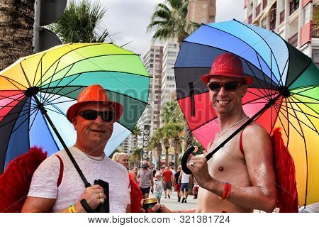 Benidorm, Alicante, Spain- September 7, 2019: Gay People With Funny Costumes Dancing And Having A Go