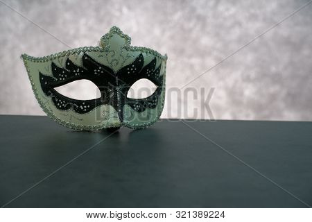 Photo Of Elegant White And Black Venetian, Carnaval Mask Over Dark Background. Vintage Photo