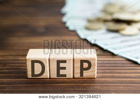 Inscription Dep Wooden Cubes With Letters, Money Coins American Dollars Banknotes,  Wooden Backgroun