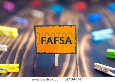 Sign Board With An Inscription Fafsa, Free Application For Federal Student Aid, On A Wooden Backgrou