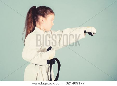 Sport Success In Single Combat. Practicing Kung Fu. Happy Childhood. Little Girl In Gi Sportswear. S
