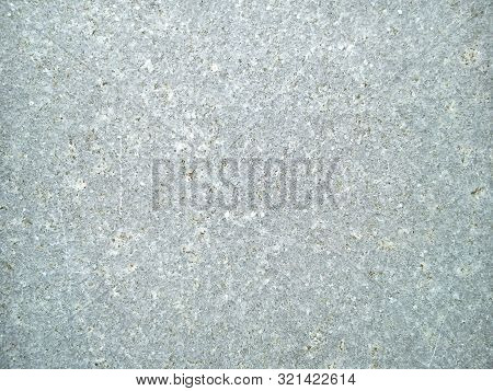 Gray Stone With White And Brown Streaks And Scratches