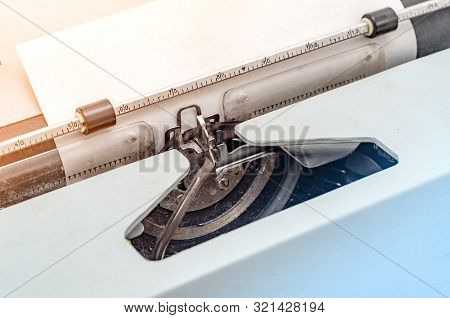 Carriage With Letters In A Mechanical Typewriter. Letter Pressed