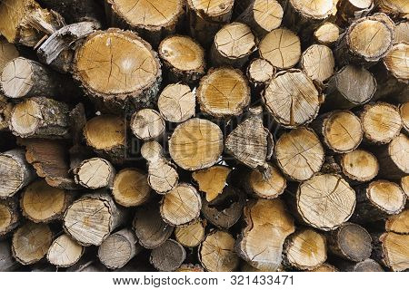 Logs Of Firewood Piled . Fuel For Stove Heating. Country Life. Wooden Firewood Stacked Wall. Natural