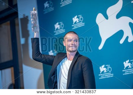 Toby Wallace poses with the Marcello Mastroianni Award for Best Young Actor for 
