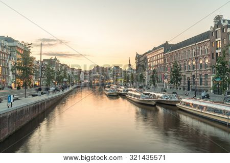 Amsterdam, Netherlands - June 6, 2019: Rokin Canal At Sunset Time. Rokin Is Major Canal In The Centr