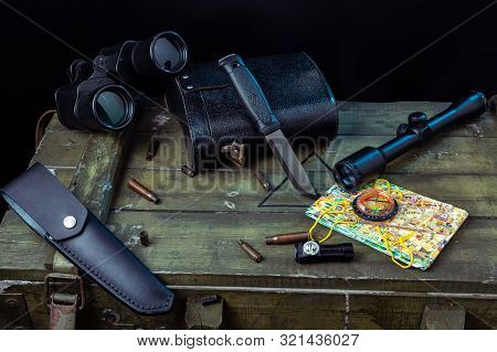 A Large Military Box And Military Equipment On It. A Large Military Box And Military Equipment On It