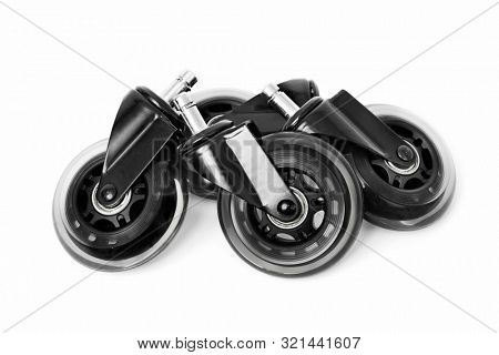 closeup of some new transparent swivel casters on a white background
