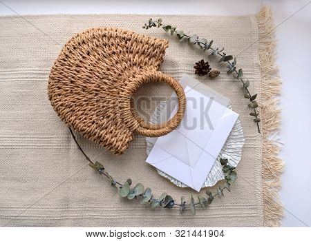 Horizontal Flat Lay Concept. Upper View Envelope With Calque, Cone, Woven Straw Bag, Decorative Sauc