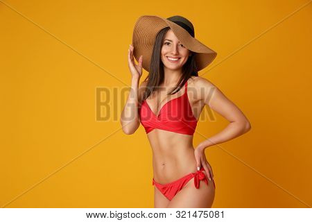 Pretty Sexy Woman With Slim Body In Stylish Red Bikini On Orange Background, Space For Text