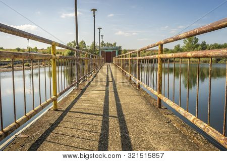 The Bridge Overlooking Lake Sovinac Is Located In The Middle Of The Cottage