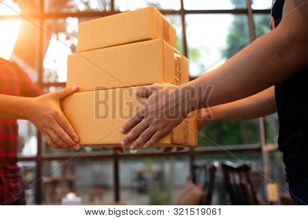 The Customer Receives The Goods And Sends Them To The Courier, Receiving One Box From The Consignee.