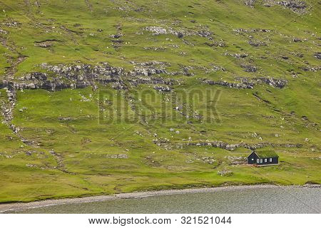 Traditional Faroe Green Rocky Landscape With Picturesque Turf House