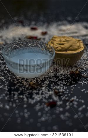 Ubtan/face Mask/face Pack Of Multani Mitti Or Fuller's Earth On Wooden Surface In A Glass Bowl Consi