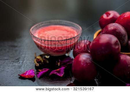 Healthy Face Mask Of Plum Or Aloo Bukhara In A Glass Bowl On The Wooden Surface Consisting Of Plum E