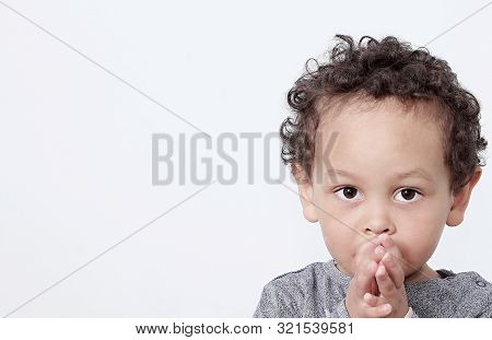 Boy Praying To God Stock Image With Hands Held Together On White Background Stock Photo