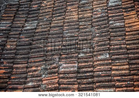 Top Shot Of The Old-styled Rectangular-shaped Rooftop Tiles Fixed On A Roof Of The House.