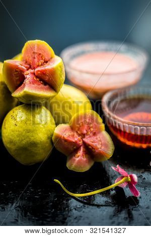Skin Whitening Remedy/treatment On The Black Shiny Surface Consisting Of Guava Pulp And Honey. Also