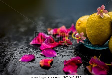 Raw Organic Guava Or Amrut Or Amarood In Hindi Language On Black Shinny Surface In A Blue-colored Pl