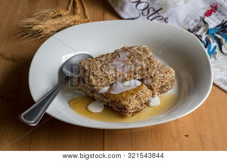 Cereal Wheat Bars In Plate With Milk And Honey - Wheat Spears In Background