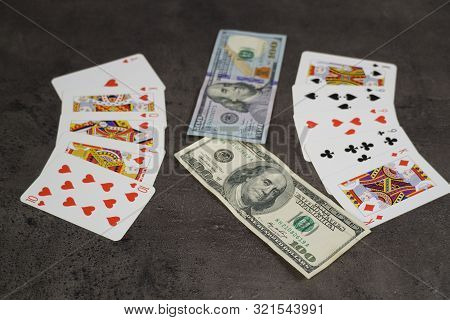9 09 2019 Tallinn, Estonia: The Combination Of Flash Royal Cards On A Gray Table With Money And Gold