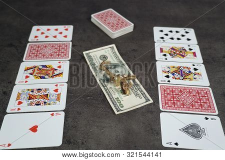 9 09 2019 Tallinn, Estonia: The Combination Of Flash Royal Cards On A Gray Table With Money And Gold